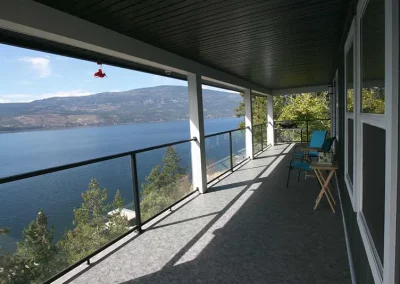 Carrs Landing finished vinyl deck and glass railing with view