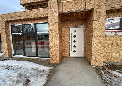 North end framing, custom front door installed