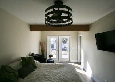 LoneWolf Homes Bay Ave primary bedroom with ceiling fan