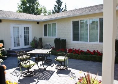 LoneWolf Homes Mission bungalow courtyard with paver stones