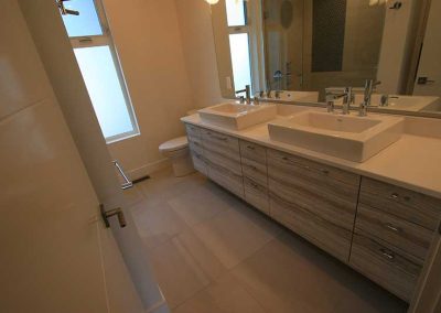 LoneWolf Homes Rayburn Ensuite custom millwork, oversize heated tile floor