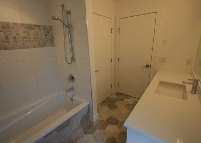 LoneWolf Homes Rayburn guest bathroom with funky tile