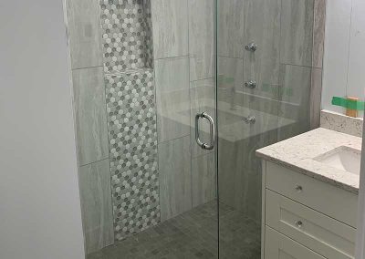 Westside guest bathroom tiled shower