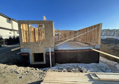 Tupman house framing going up on sunny day