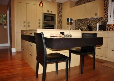 LoneWolf Homes Mission bungalow kitchen with custom table through island