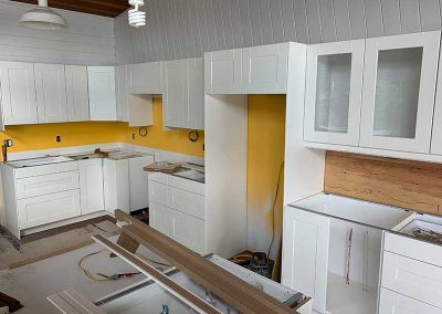 Westside kitchen cabinets being installed