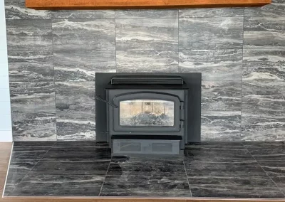 Westside wood fireplace with grey marble surround